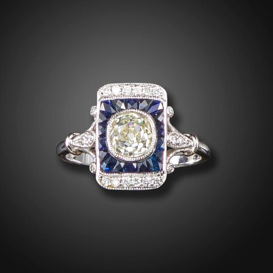 A sapphire and diamond rectangular cluster ring, the old cushion-shaped...