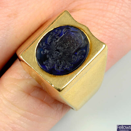 A sapphire intaglio ring, carved with an armorial.