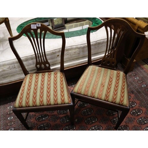 A set of four Hepplewhite style dining chairs (3 single, 1 a...