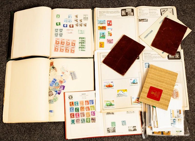 A small collection of stamps albums including an all