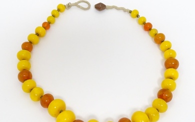 A vintage necklace of graduated amber beads. Approx 24" long