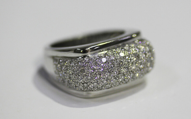 A white gold and diamond ring, the raised bombé style centre mounted with circular cut diamonds