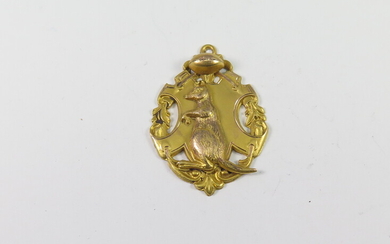 AN AUSTRALIAN 9ct YELLOW AND ROSE GOLD RUGBY FOOTBALL FOB MEDALLION