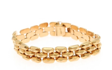 An 18k gold bracelet. L. app. 19.2 cm. W. app. 1.3 cm. Weight app. 21.6 g.