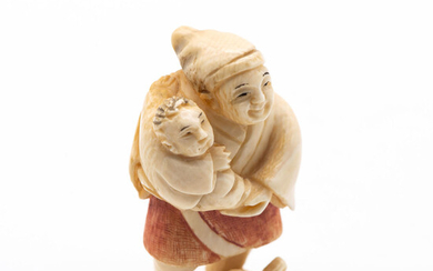 An Antique Japanese Carved Ivory Polychrome Nestuke of a Father and Infant