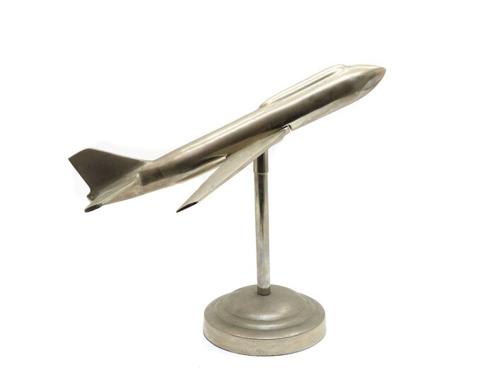 An Art Deco style chrome model of an aeroplane