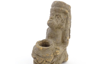 An Aztec Pre-Columbian style earthenware sculpture depicting...