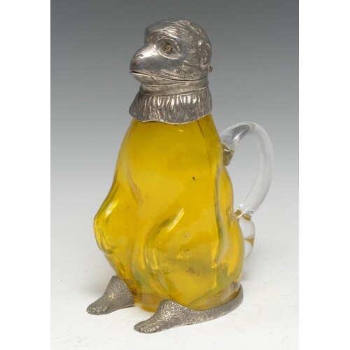 An E.P.N.S and yellow glass novelty claret jug, as a monkey,...