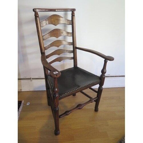 An antique, circa 1800, ash and elm ladder back elbow chair ...