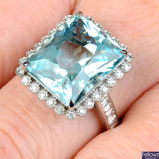 An aquamarine and brilliant-cut diamond cluster ring, with baguette-cut diamond line shoulders.