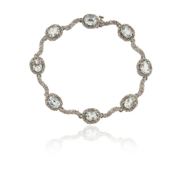 An aquamarine and diamond bracelet, set with aquamarine...