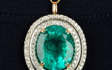 An emerald and circular-cut diamond pendant.