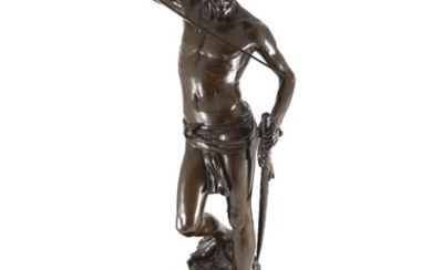 Antonin Mercié (1845-1916). Figure en bronze de David debout tenant une épéeavec son pied reposant...