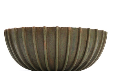 Arne Bang: A stoneware bowl decorated with greenish and brownish glaze. Signed AB 189. H. 11. Diam. 26 cm.