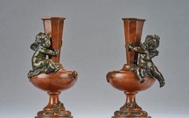 Auguste Moreau, a pair of lamp bases or pedestals for bowls or candlesticks, with seated putti, France, c. 1900
