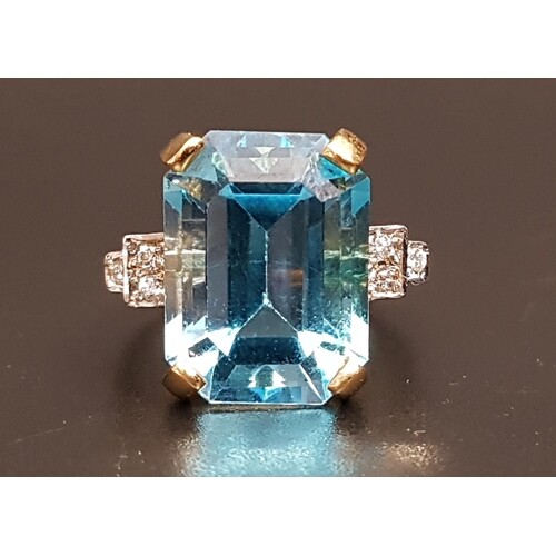 BLUE TOPAZ AND DIAMOND COCKTAIL RING the large emerald cut b...