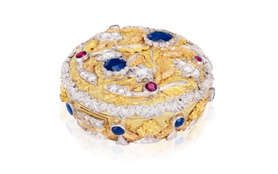 Boîte à pilules en diamants et pierres précieuses La boîte circulaire bicolore décorée de motifs...