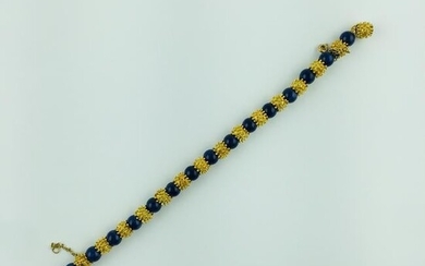 Bracelet in 18 K yellow gold and lapis lazuli sphere