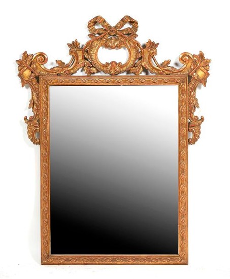 Carved and gilded wood mirror of rectangular shape...