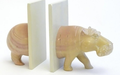 Carved novelty bookends modelled as the front and back