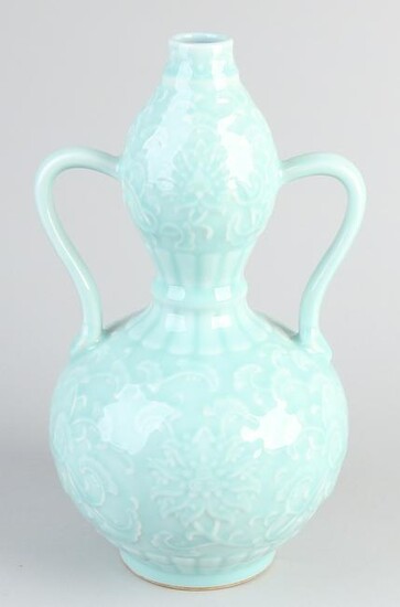 Chinese porcelain knump vase with floral relief +