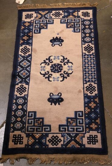 Chinese rug with a center floral medallion and a cobalt