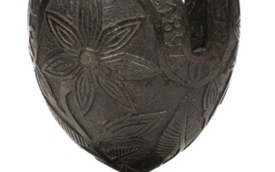 Coconut. A 19th century carved coconut