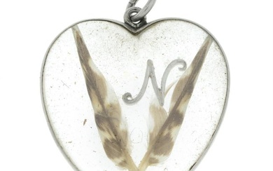 Early 20th century platinum heart-shape feather pendant.