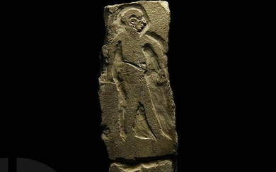 Egyptian Limestone Relief with Striding Figure