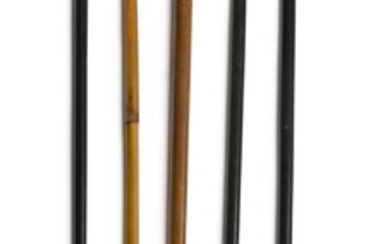 FIVE CANES WITH METAL HANDLES Handles in assorted metals and styles; two are figural. All with wooden shafts. Lengths from 30" to 34".