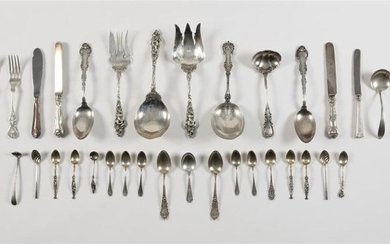 FORTY-ONE PIECES OF AMERICAN STERLING SILVER FLATWARE Together with one silver plated knife. 1-3) Three serving pieces decorated wit...
