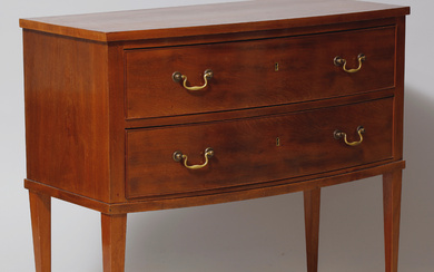 FRITS HENNINGSEN (1889-1965). Chest of drawers with curved front and tapered legs, mahogany, brass handles, Denmark.