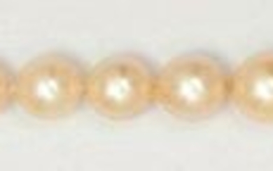 Falling necklace of cultured pearls. Yellow gold ratchet...