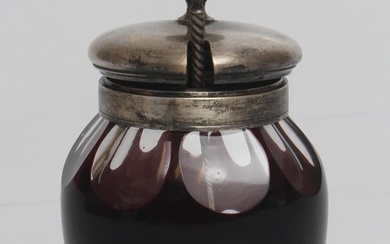 Glass jar for tea with spoon Beginning of 20th century. Colored glass, ground. Silver plated metal. No cracks, perfect condition. Height 13 cm, width 8 cm. The length of the spoon is 13 cm.