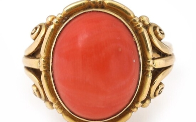 Just Andersen A coral ring set with a cabochon coral, mounted in...