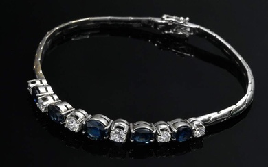 Narrow white gold 750 bracelet with sapphires (add. ca. 2.75ct) and diamonds (add. ca. 0.85ct/P1/TW), 16g, l. 18,5cm