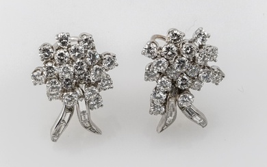 Pair of Platinum, 14-Karat White-Gold and Diamond French Clip-Back Pierced Earrings, Total weight of diamonds: 5 carats; Total gross weight: 8.8 dwt; Length: 1 in (2.5 cm)