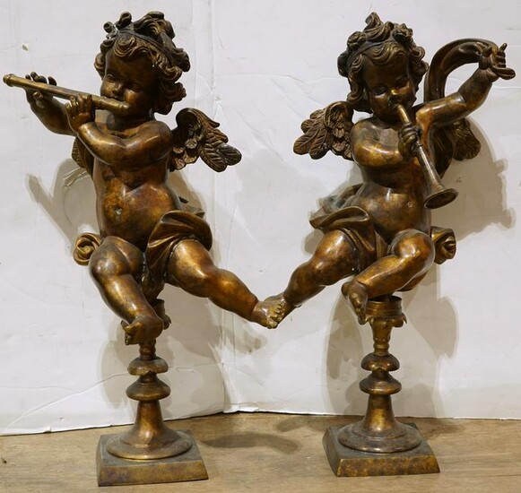 Pair of Rococo style gilt metal figural sculptures of