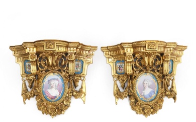 Pair of spectacular French gilt bronze consoles with porcelain miniatures.