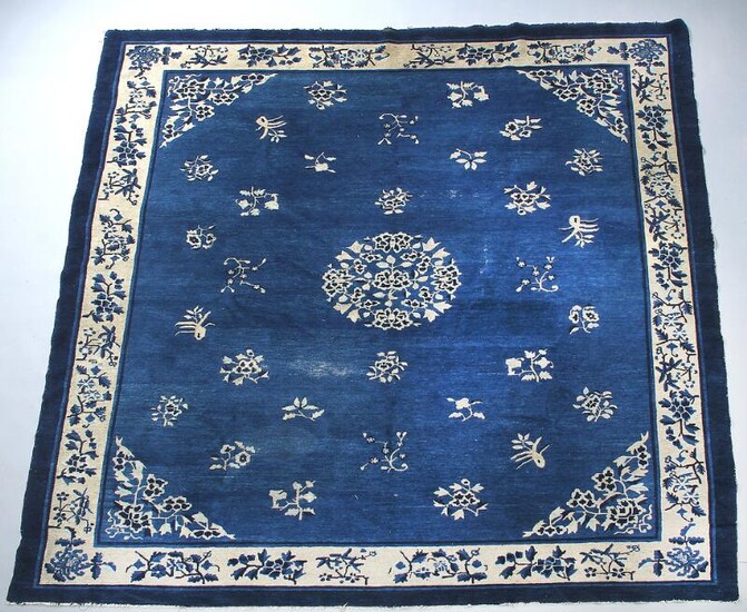 NOT SOLD. Peking rug, China. Simple design of flowers and centre rosette on a blue field. Early 20th century. 285 x 247 cm. – Bruun Rasmussen Auctioneers of Fine Art