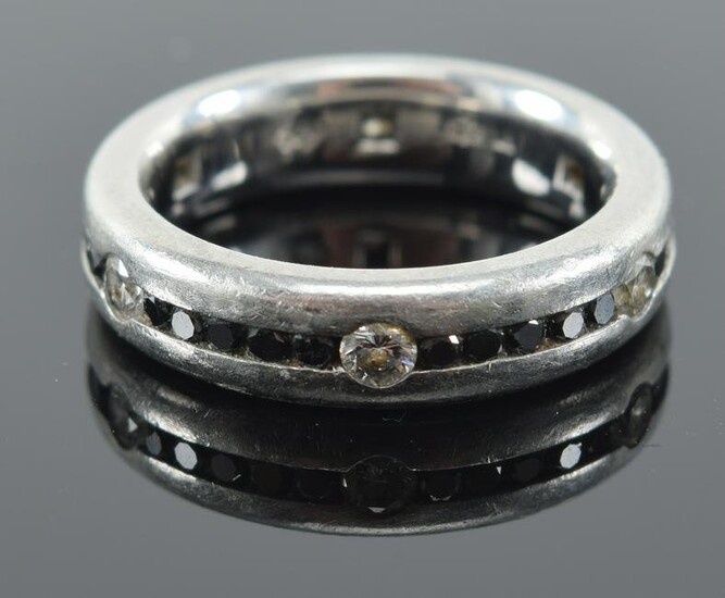 Platinum diamond and sapphire channel ring. Band of
