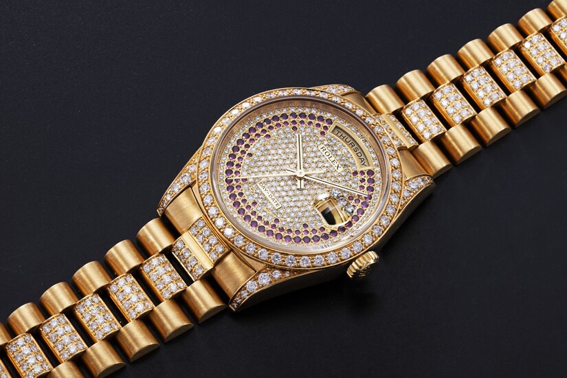 ROLEX, A GOLD OYSTER PERPETUAL DAY-DATE WITH DIAMONDS AND RUBIES, REF. 18388