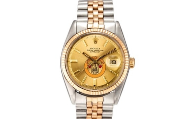 ROLEX | DATEJUST, REFERENCE 1601, A YELLOW GOLD AND STAINLESS STEEL WRISTWATCH WITH DATE, ABU DHABI DEFENSE FORCE EMBLEM AND BRACELET, CIRCA 1973