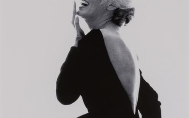 STERN, BERT (1929-2013) Marilyn Monroe laughing in black Dior dress