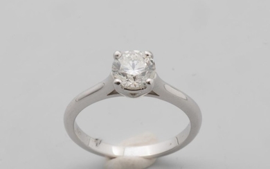Solitaire ring in 18k white gold surmounted by...
