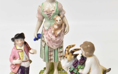 Three early 19th century porcelain figures comprising a girl with...