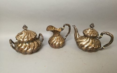 Three service pieces with twisted decoration in silver...