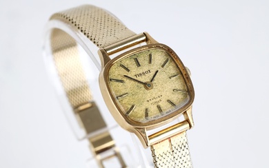 Tissot Stylist of 18 kt. gold with 14 kt. gold chain, 32.0 g.
