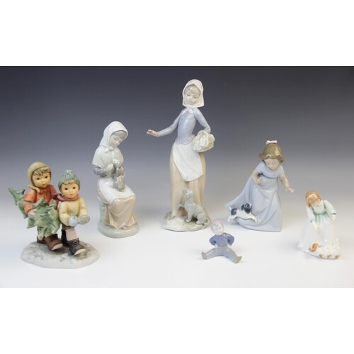 Two Nao figures, one modelled as a girl and puppy, 16.5cm hi...