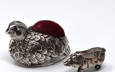 Two antique sterling Silver pin cushions: a pig and a quail